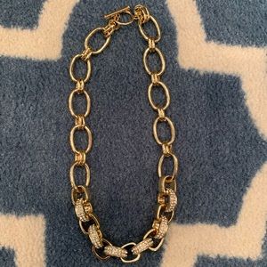 Gold tone chain necklace.